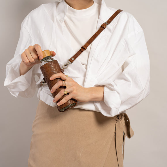 Glass water bottle with strap